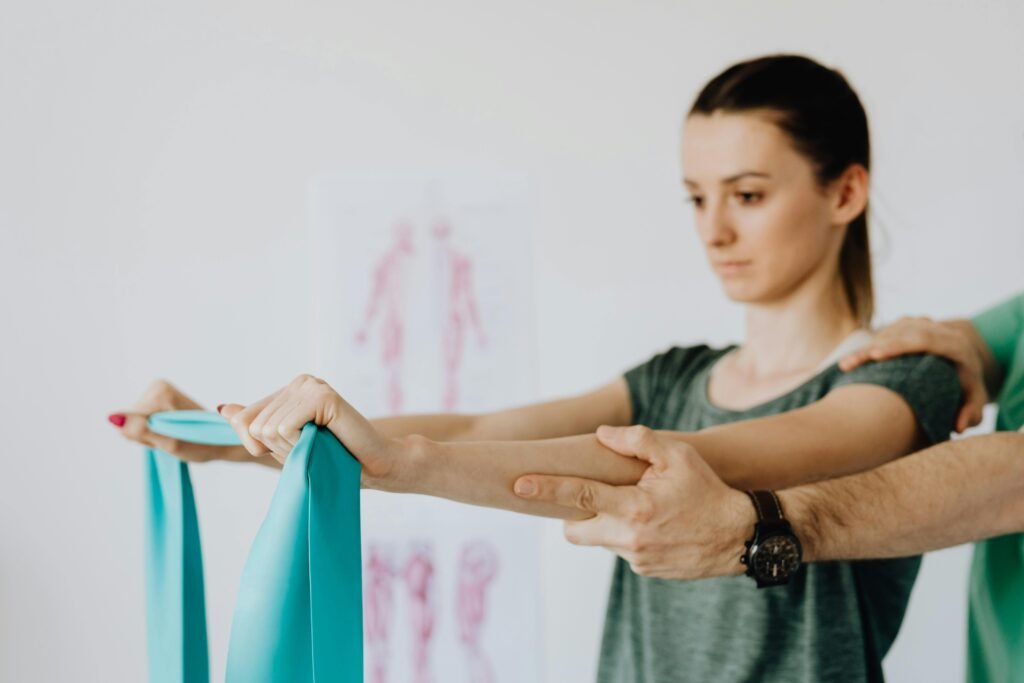 What to Expect at Your First Exercise Physiology Session Client working through a resistance band exercise during an exercise physiology session in Brisbane